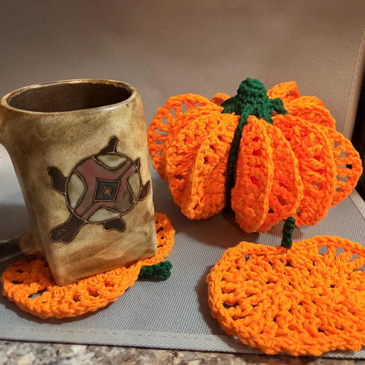 Bright orange coasters with a mug, made by a customer
